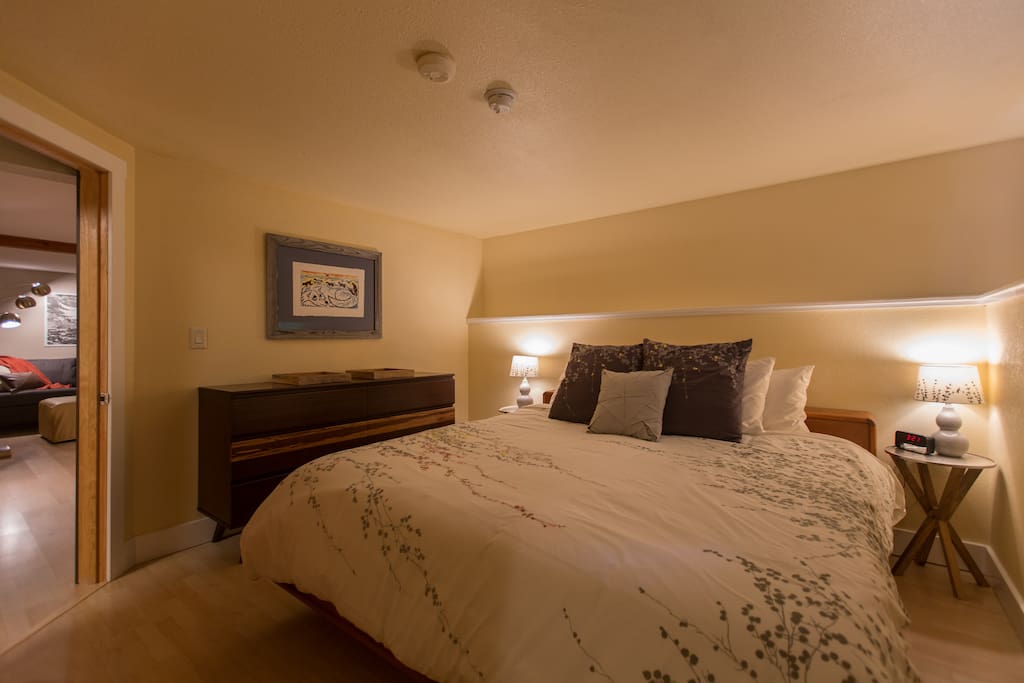 King tempurpedic bed with luxury linens in the private bedroom