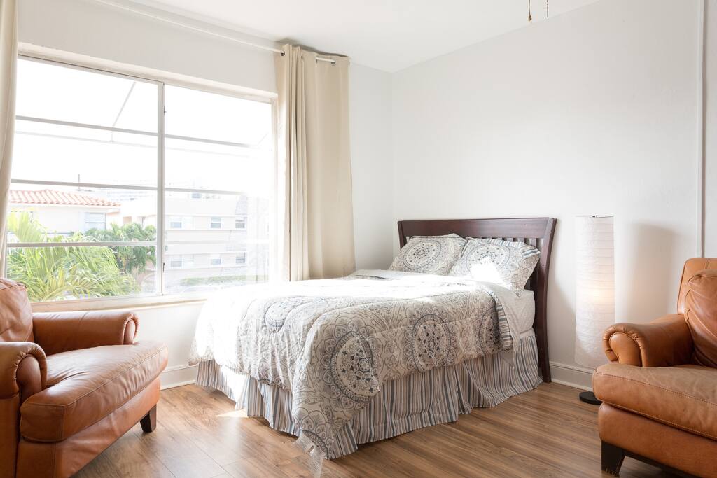 Bright, airy, roomy common area. (With a double bed and large TV.)