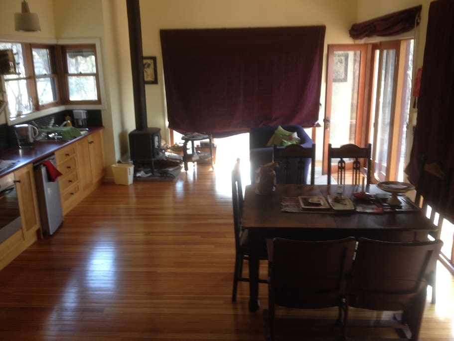 Dining and lounge area - couch is now a green sofa/bed