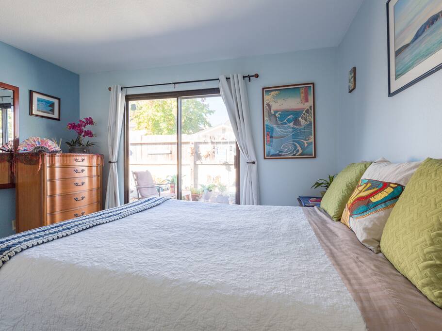 Nicely decorated spacious room with sliding glass door.
