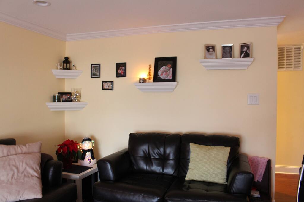 Main living room with a leather sofa & love seat. Large 50 inch flat screen TV with BlueRay & cable. (Located upstairs next to the kitchen).