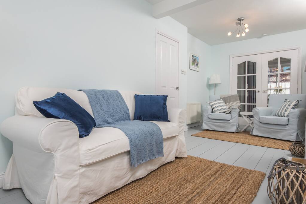 Comfy sofa and armchairs, perfect for relaxing after touring the city