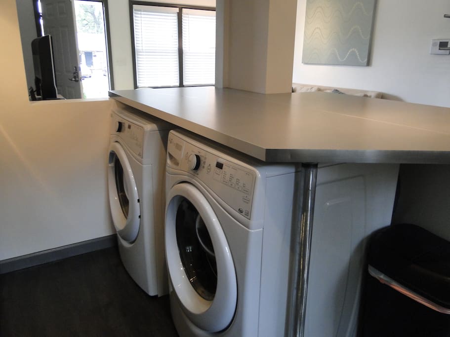 Washer and dryer cleverly hidden under kitchen island