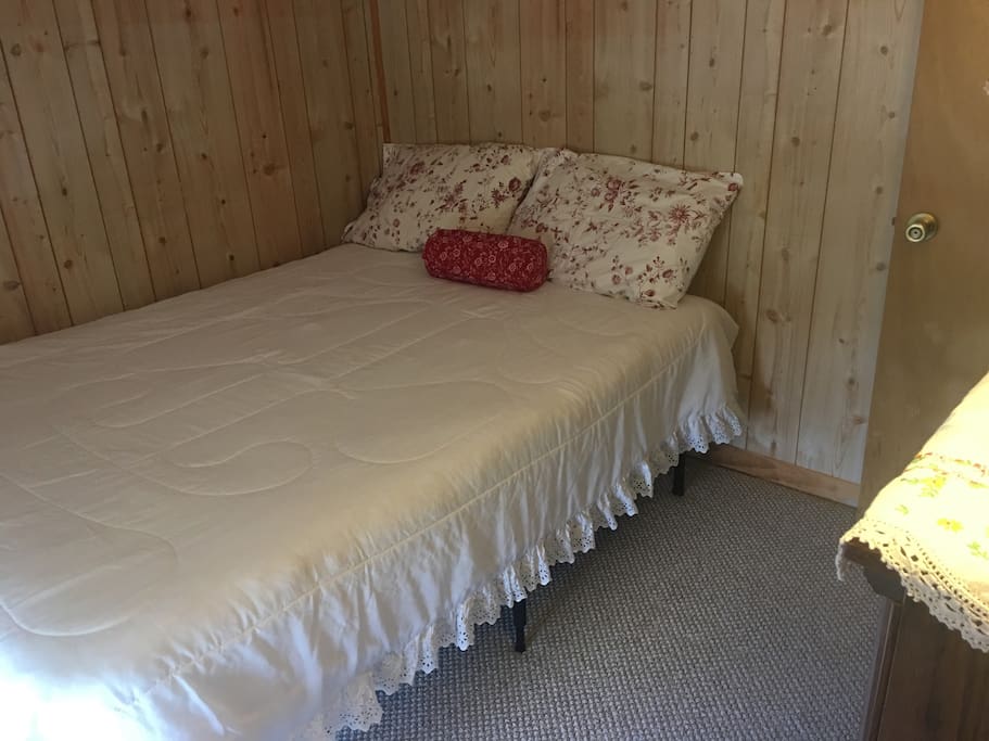 One of two bedrooms with full size bed.