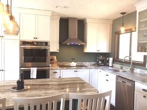 Successful Airbnb property: Peaceful waterfront home with dock/ hot tub in East Falmouth