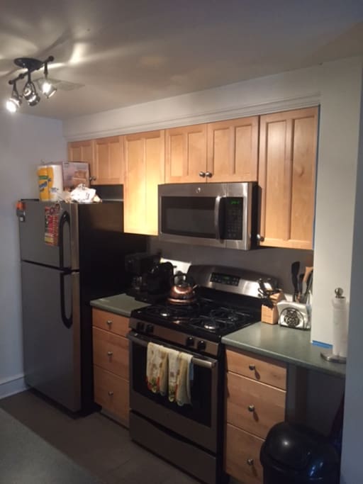 Brand new stainless steel appliances, track lighting, coffee pot & nespresso machine (includes coffee, filters & espresso pods)