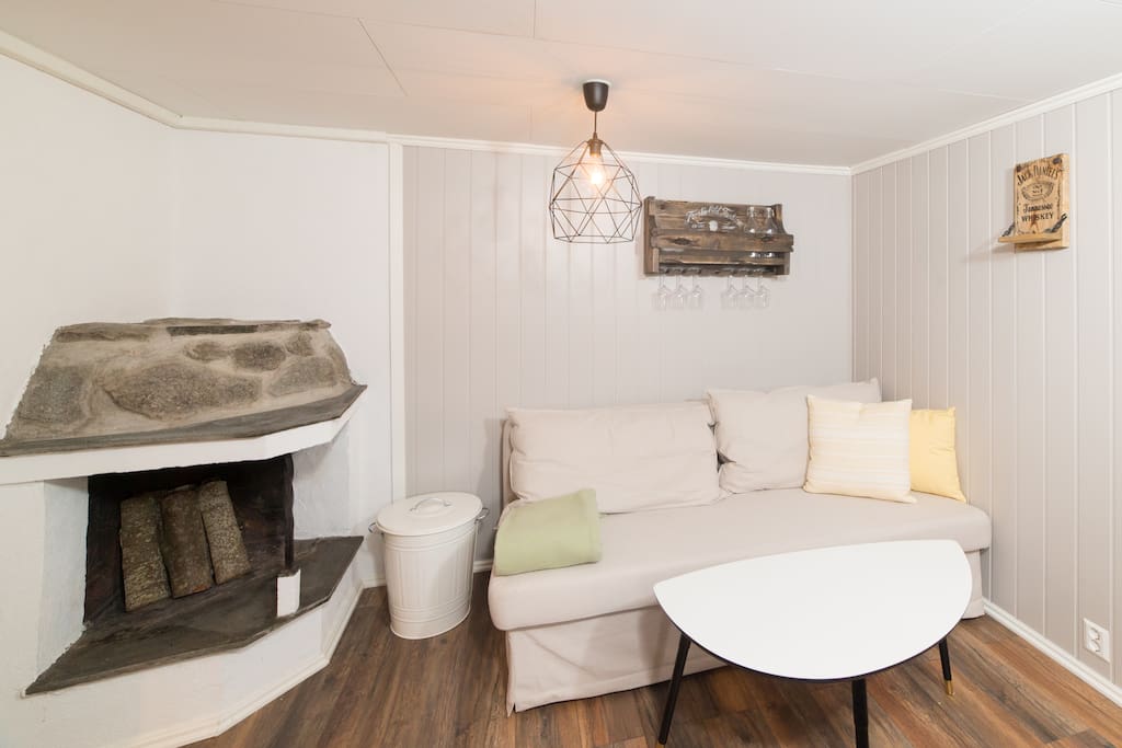Sofa bed and fire place.