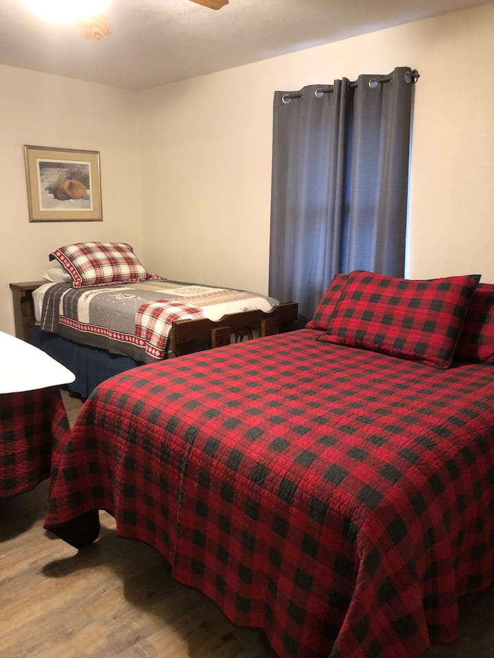 This is one of the bedrooms in top of the Bunkhouse.  This picture shows a full and single bed, but there is also a king bed in this same bedroom.