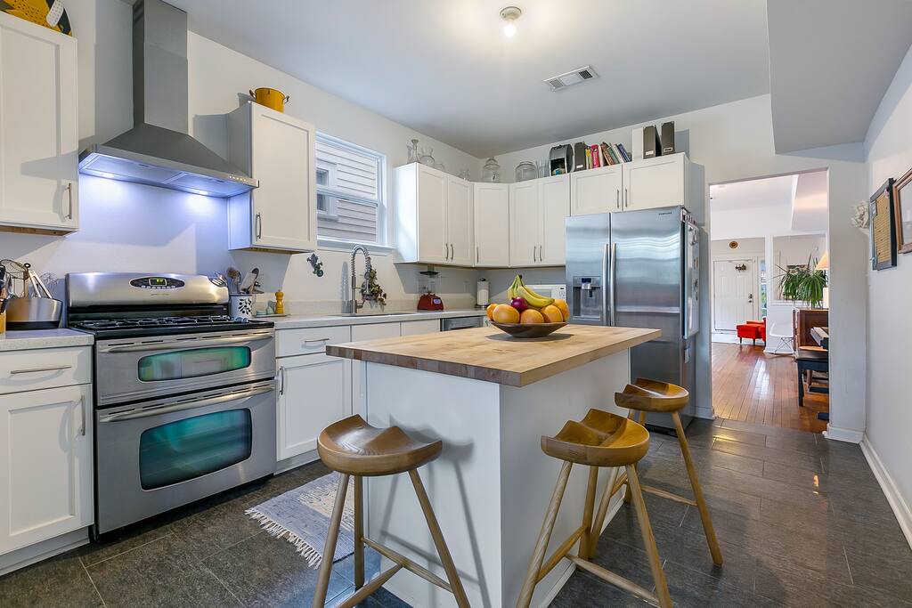 Fully stocked kitchen with double stove, available for guest use