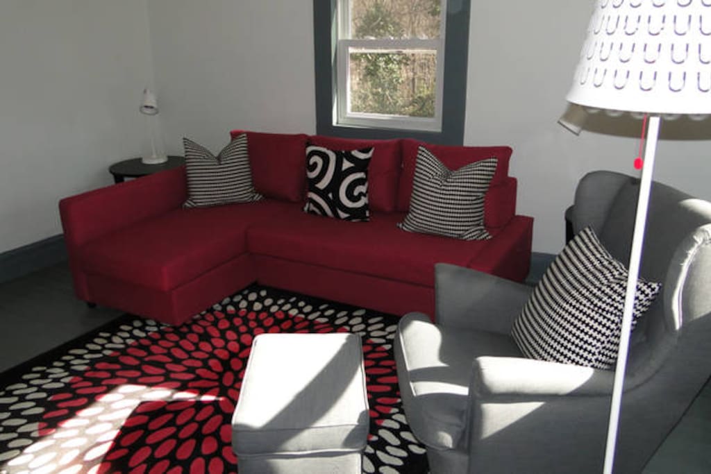 Living room at Swamp Rabbit Cottage furnished in IKEA, sofa bed