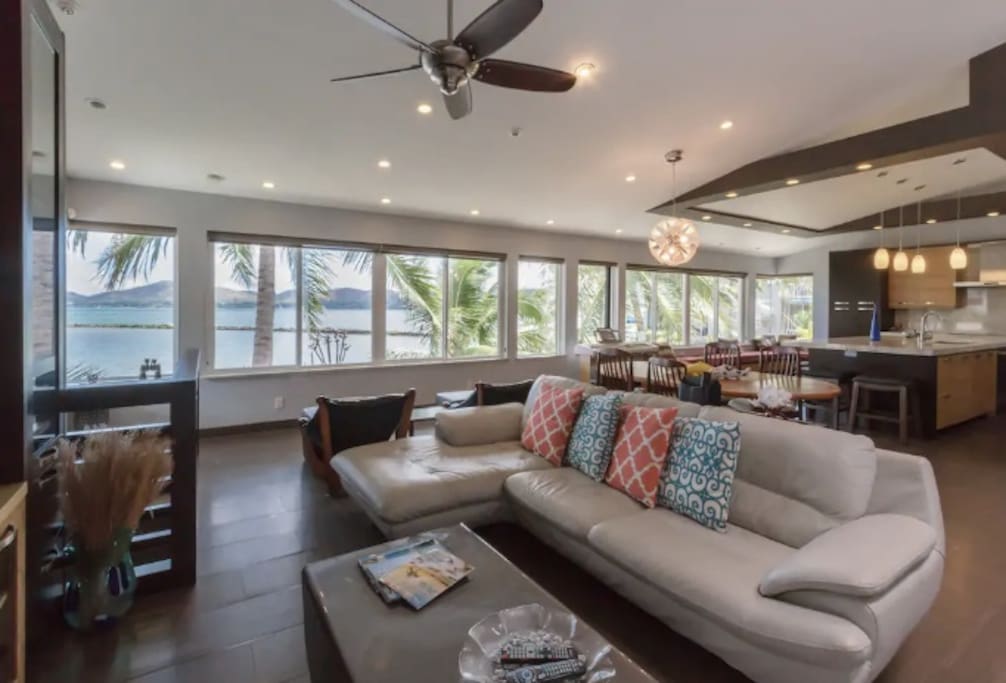 The home has an open floor plan and comfortable seating. Expansive views with wall to wall windows.