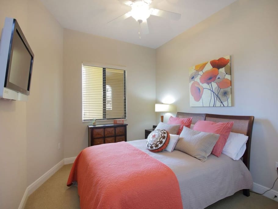 Guest bedroom also displays custom designer touches with coordinating decor & queen size