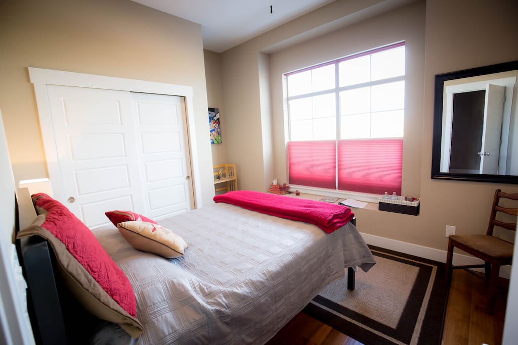 Your room has a ceiling fan, big windows with lots of light and a view of the park.