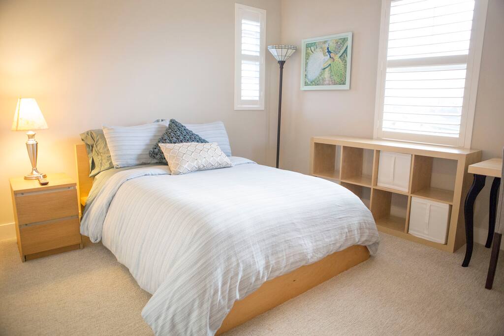 Your plush and cozy room with a small ocean view