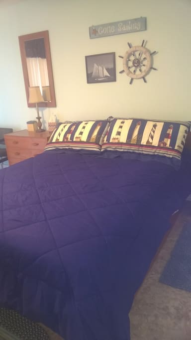 Queen bed in bedroom.