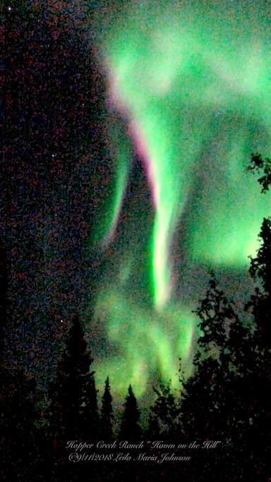 Auroral KP 6 activity on 9/11/ 2018. I took this photo standing our deck that faces to the south. The same way the apartment living room window faces.