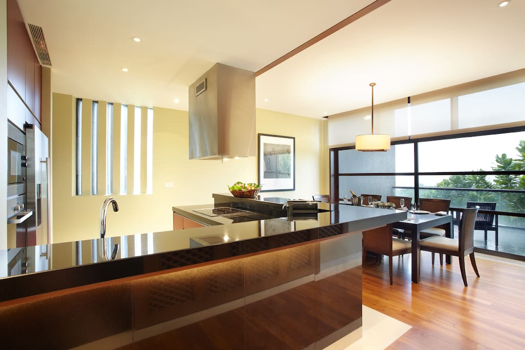Designer kitchen appliances with island concept dining table