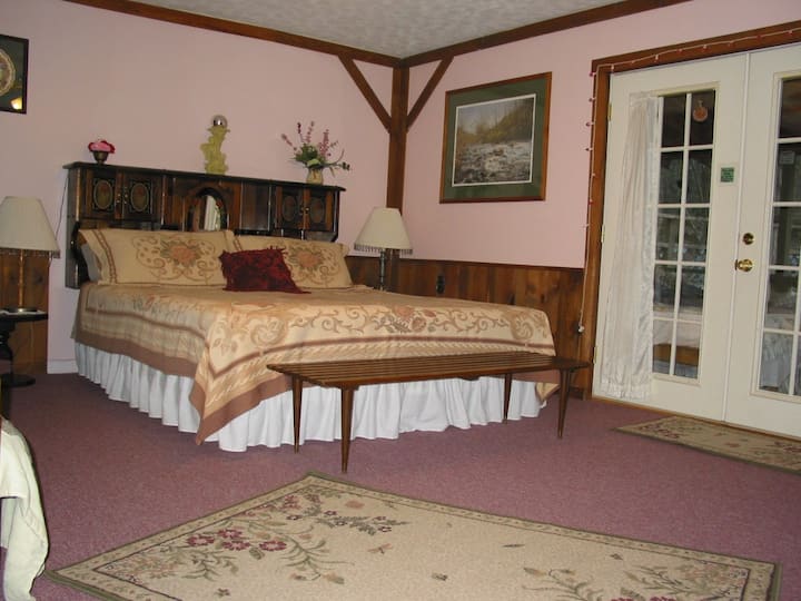 Master Bedroom, french doors open onto screened porch.
