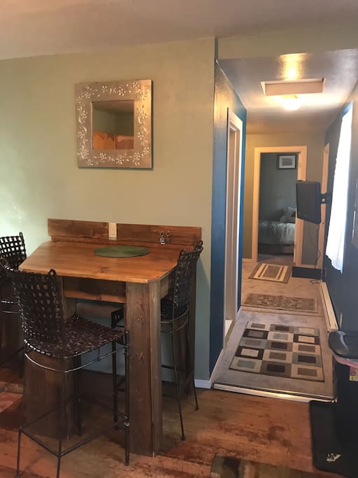 Kitchen table, hallway, small bedroom