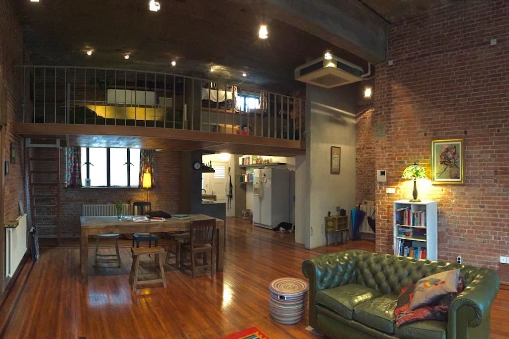 Looking back toward kitchen and dining area with the mezzanine 2nd bedroom