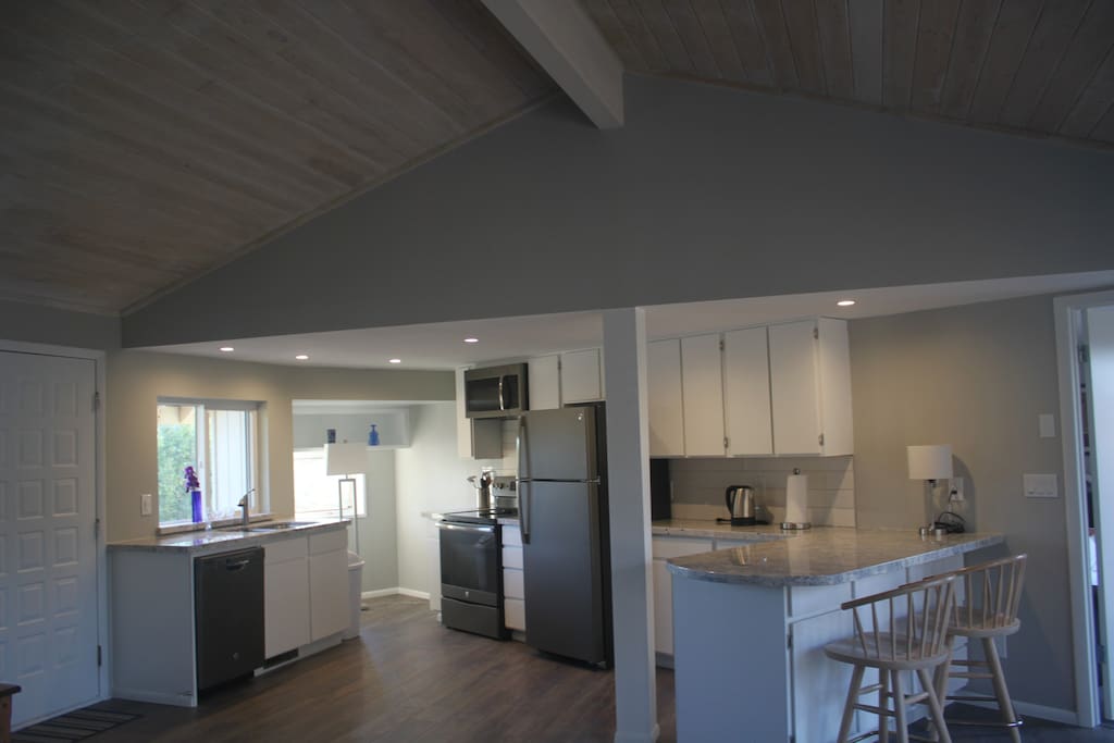 High vault ceilings and open concept. The kitchen is fully stocked with cooking supplies.