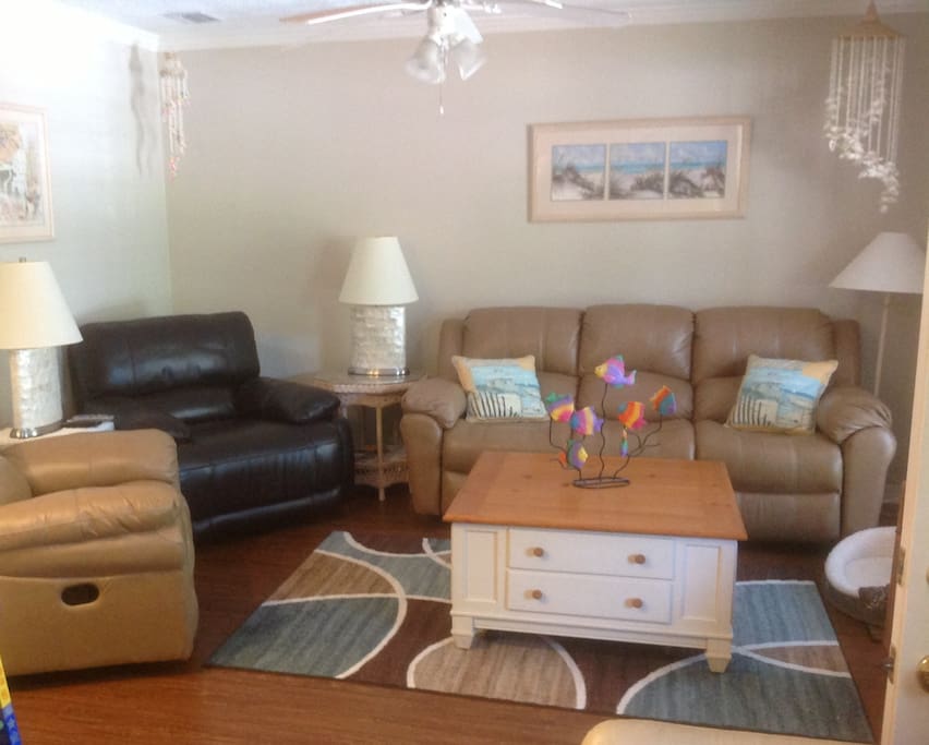 Comfortable living room, newly updated, complete with cushy recliners & flat screen TV.