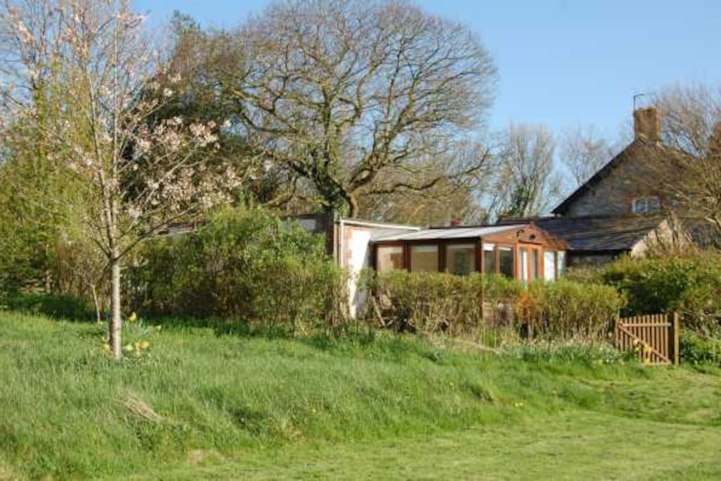 Set in an acre of orchards and mixed woodland.