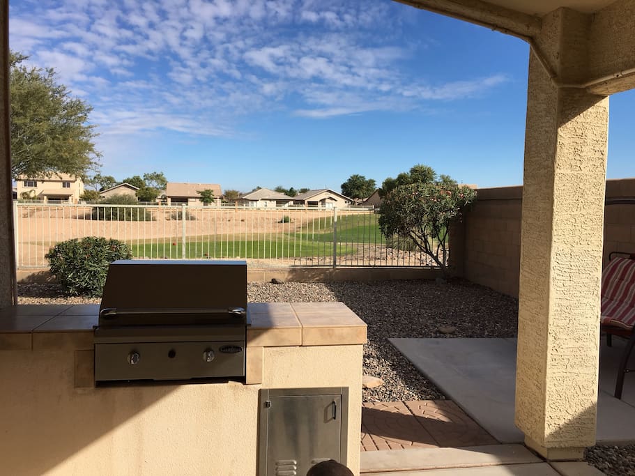 Outdoor kitchen and view of the women's twelve Tee. Box