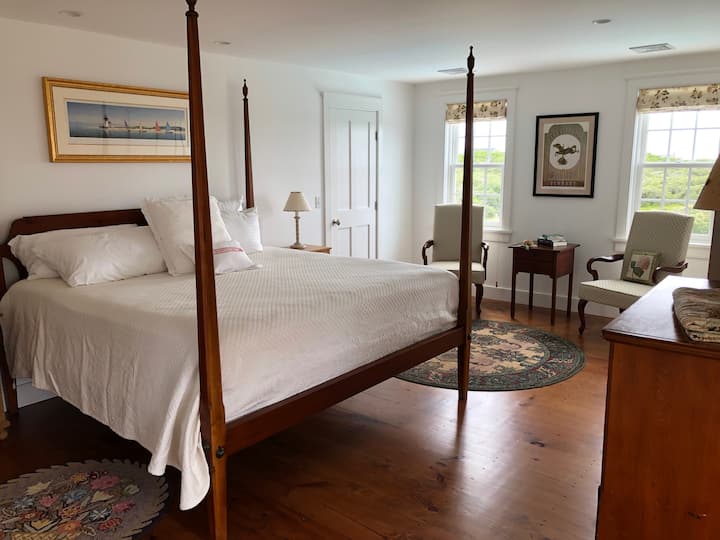 The windows to the south side of the 2nd floor master bedroom overlook the pool patio area.