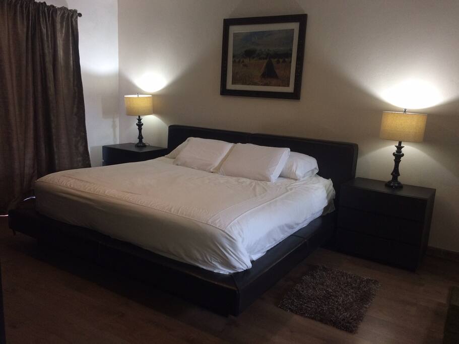 King Bedroom (Upstairs) with private bathroom with tub.
