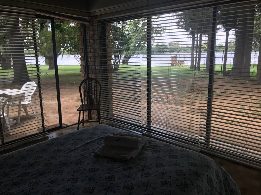 The main room with the best view on the property. 180deg view of the river. Has a triple and single sliding door which can be opened for those warm days when you want to take a breezy afternoon nap