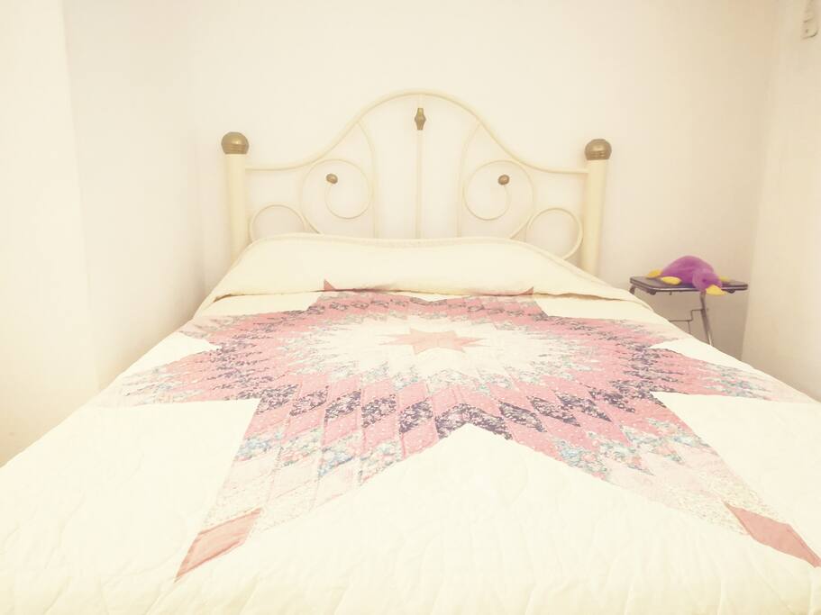 Private room with double bed, bathroom and small kitchen.