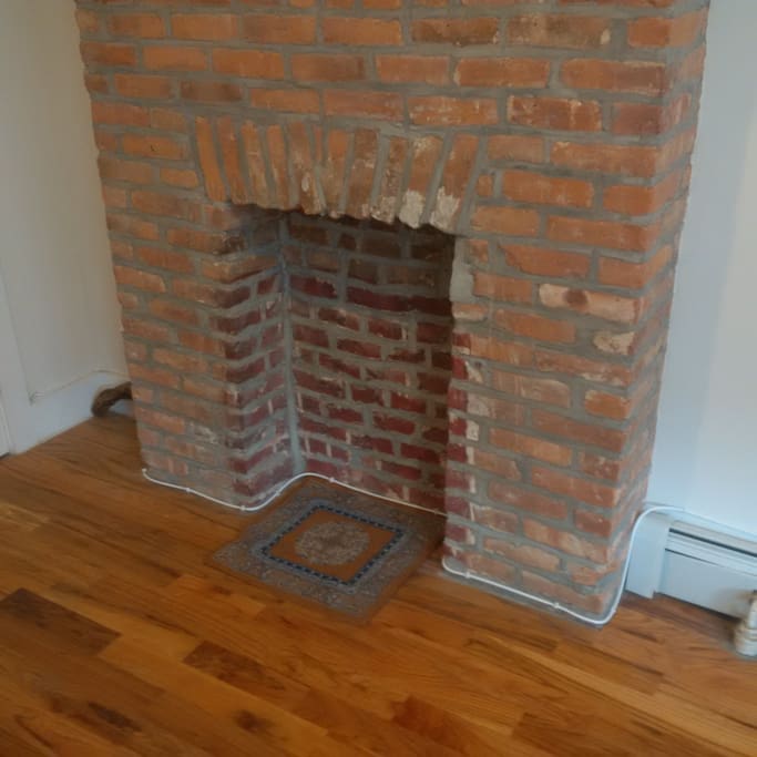 Exposed Brick faux fireplace feature