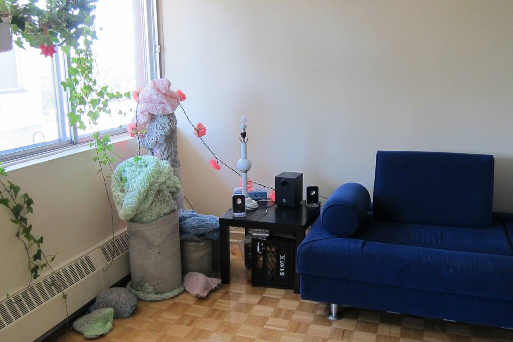Living room with sofa bed and sound system