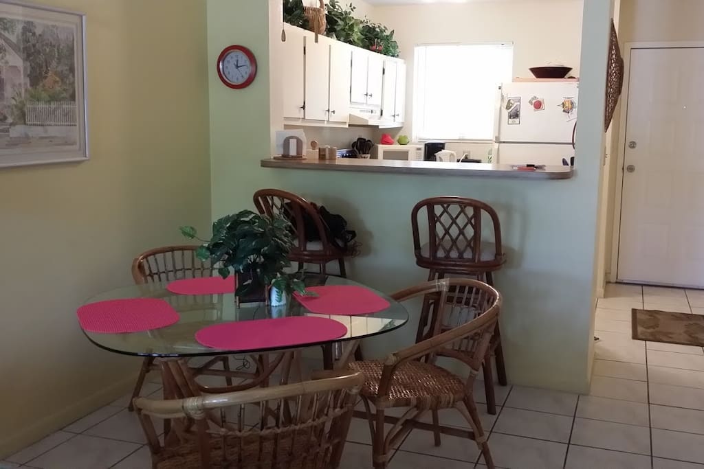 Dining room and breakfast bar with kitchen pass-through.