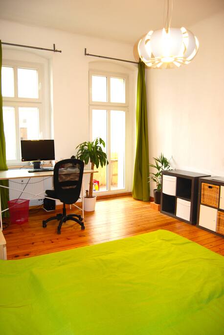 spacious room | desk and access to balcony
