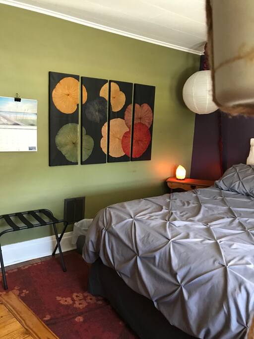 Queen Bed with sofa and tv