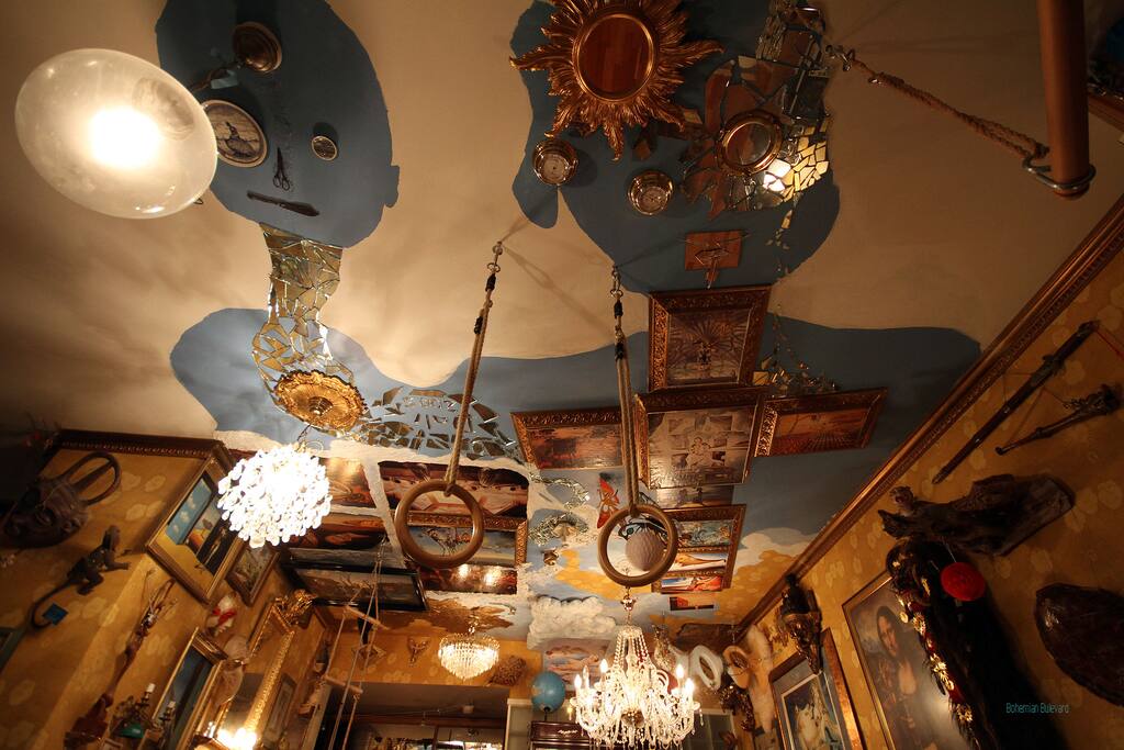 Part of my living room Salvador Dali ceiling. I made the "Dali-sky" 2005 to salute the great surrealist. There are images of multiple works of Salvador Dali accompanied with stuffed animals, curios, other paintings, etc. inspired by Dali´s home and Castell de Púbol. After a long travelling day you may sit on one of the sofas and marvel the Dali-sky or check what is there in telly. Or check if there are some movies in my DVD / Blue Ray library that matches your taste.