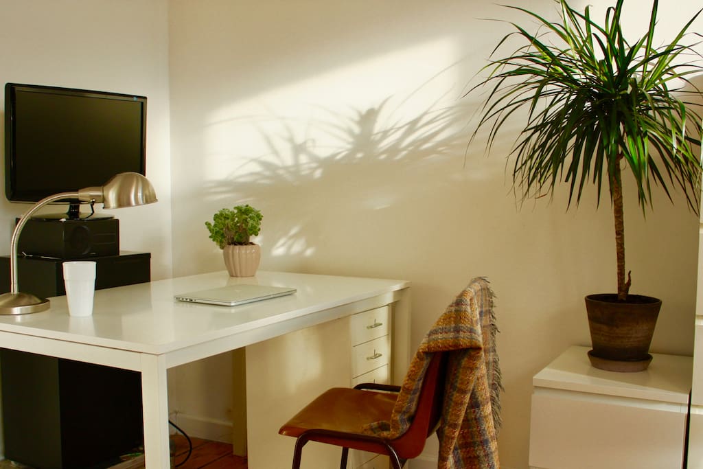 The desk in the bedroom where you can work