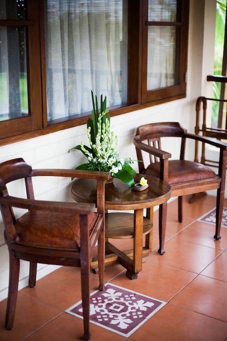 Coffee table and chairs at the terrace with pool & rice field views