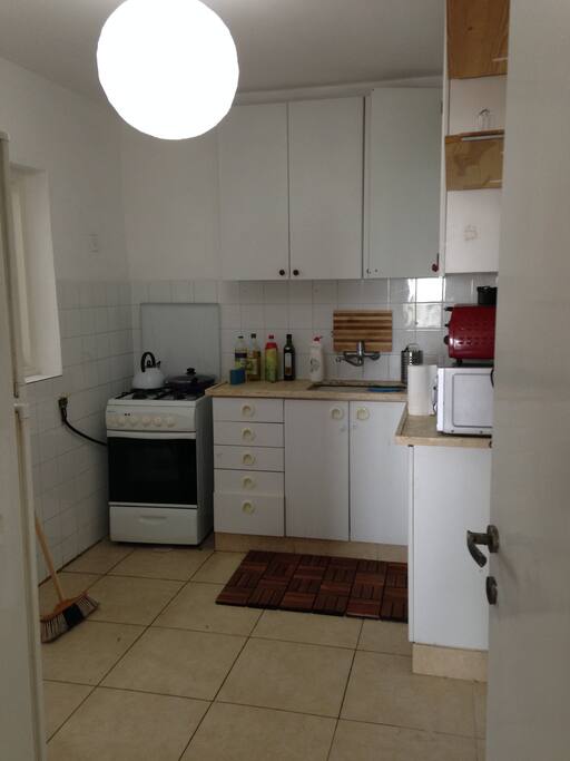 kitchen- microwave, toaster, stove, oven, and fridge