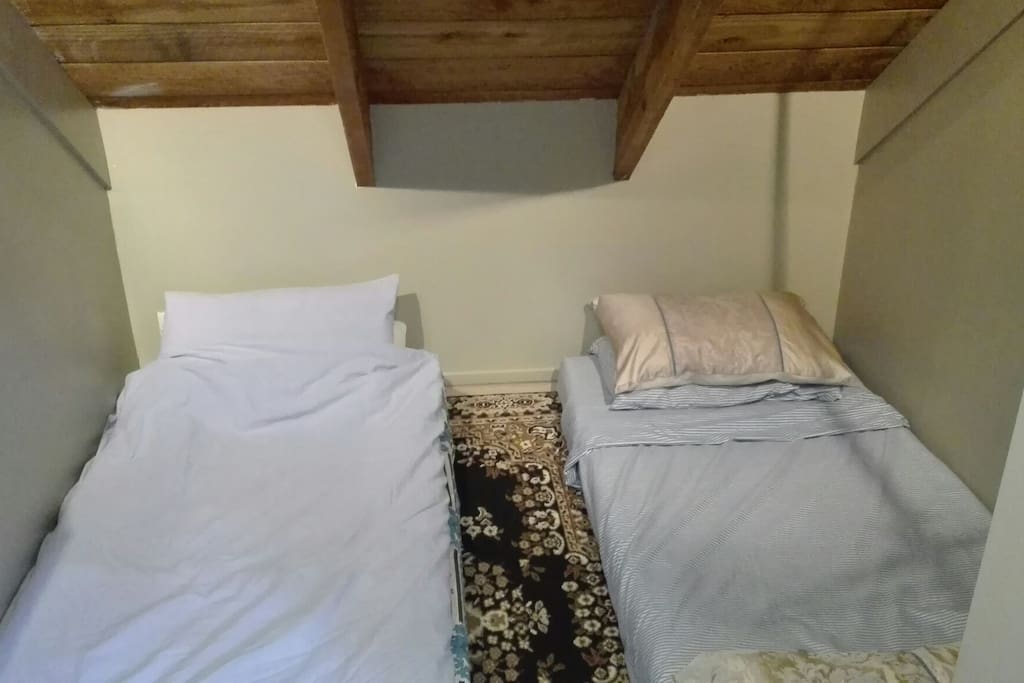 Two single mattresses in a partitioned-off area of the bedroom. Cosy and comfortable!