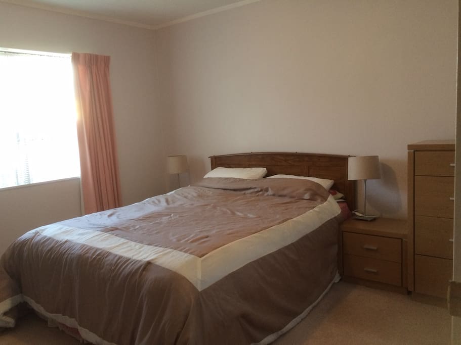 Restful master bedroom with large double built in wardrobe
