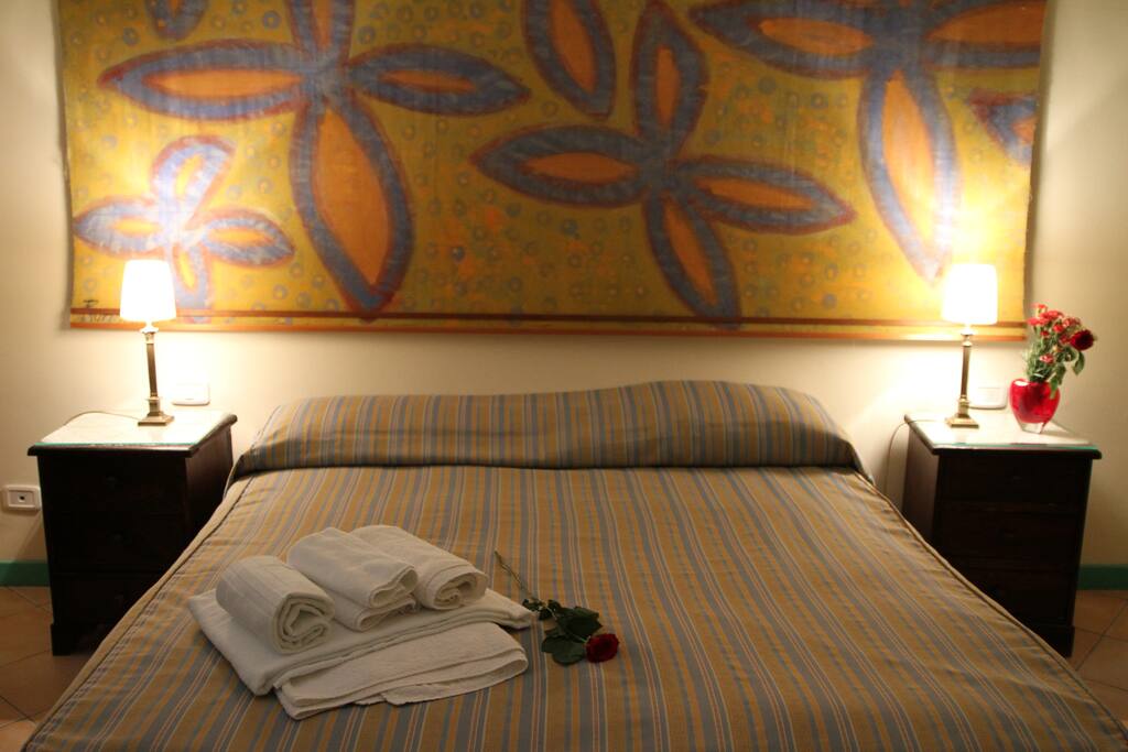 The private bedroom: the comfortable double bed with soft bed-linen and towels