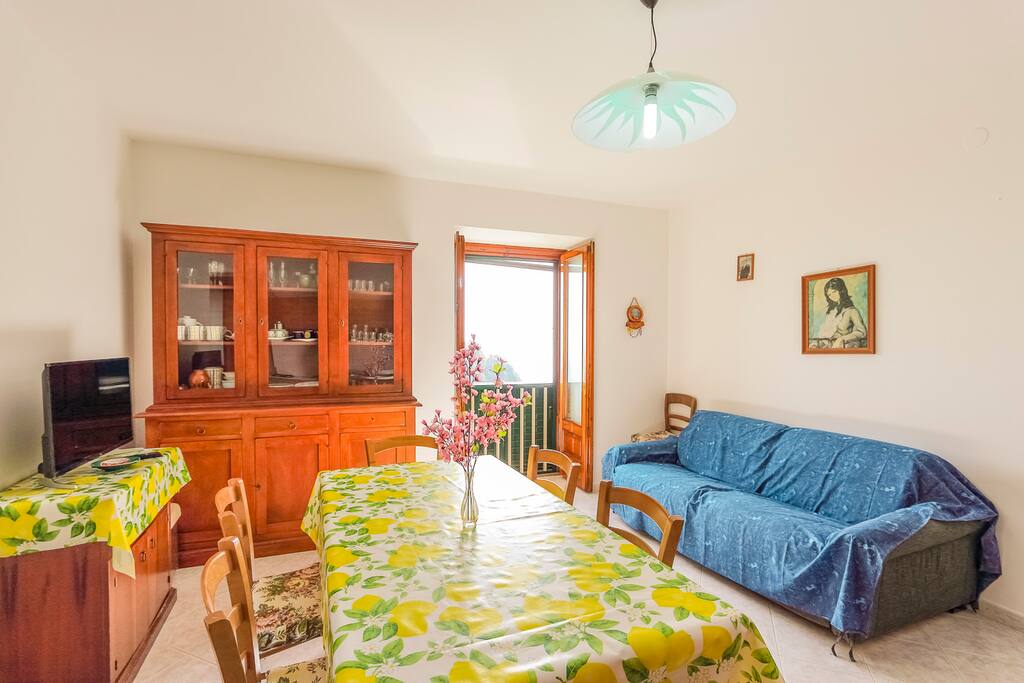 Large living area with a kitchen and a comfortable sofa bed