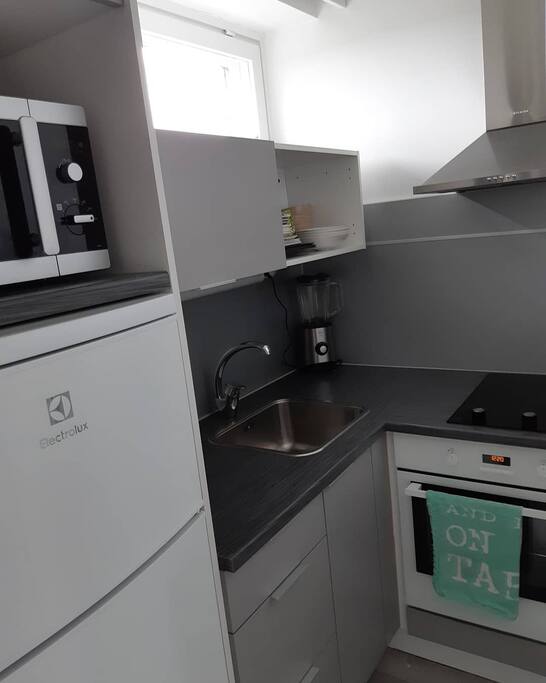 the kitchen is very small, but it is modern and just renovated.