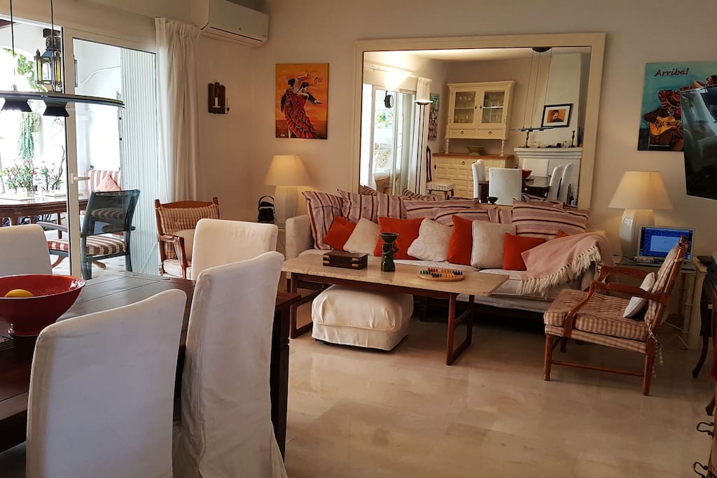 Living room in an open floor plan with dining area and kitchen. Throughout the ground level, also inthe Patio we have newly laid marble flooring.