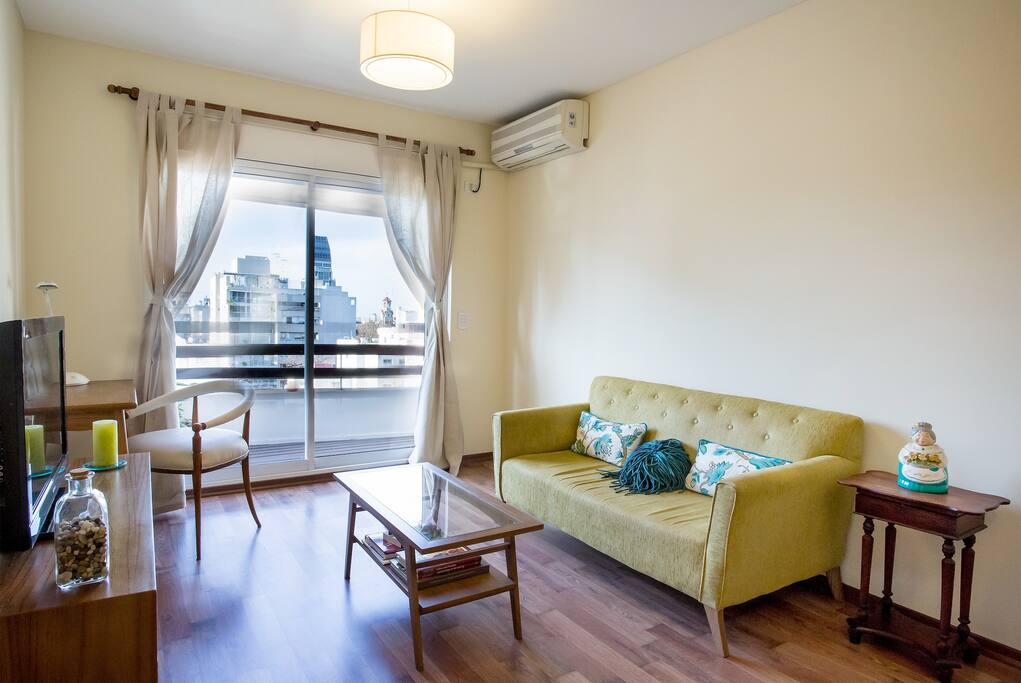Light-flooded living room with access to private balcony