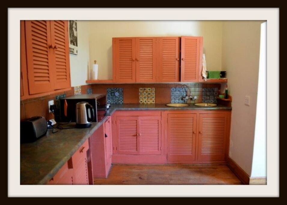 Open plan kitchen with Oregon pine wood floors.
