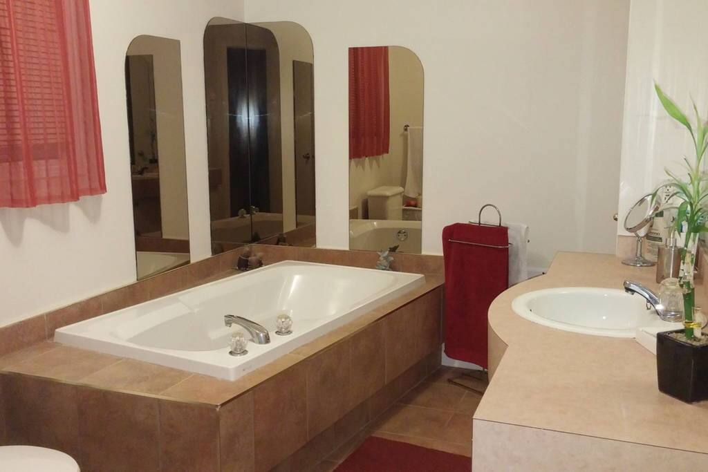 The lovely bathroom and all the essentials (towels, soap, shampoo, body wash, first aid-kit, hair-dryer, etc.). You have a bath and a shower!! ❤